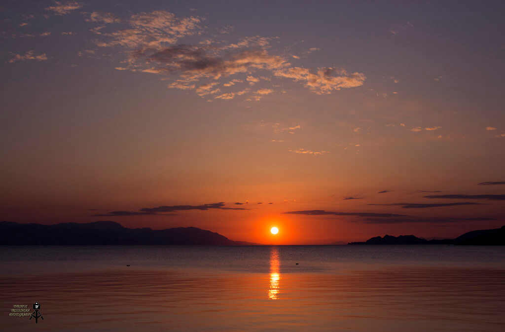Theseus Troizinian - sunset reflected in water
